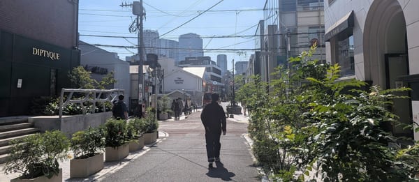 The Cat Street walkway with planters and shops on both sides